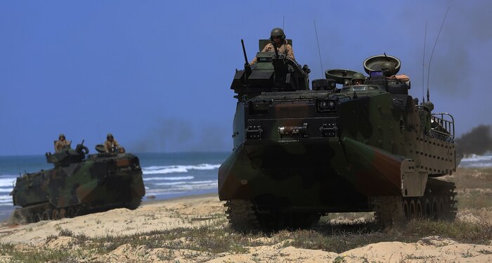 Marines with Company A, 3d Assault Amphibian Battalion, 1st Marine Division, maneuver their Amphibious Assault Vehicle to the shore aboard Marine Corps Base Camp Pendleton, Calif., after exiting the well deck of amphibious transport dock ship USS New Orleans (LPD18), during a training exercise, Aug. 22, 2015. The purpose of the training was to provide surf qualification training for the battalion’s crew members. (U.S. Marine Corps photo by Staff Sgt. Bobbie A. Curtis)