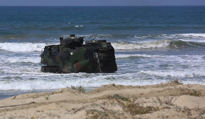 Marines with Company A, 3d Assault Amphibian Battalion, 1st Marine Division, maneuver their Amphibious Assault Vehicle to the shore aboard Marine Corps Base Camp Pendleton, Calif., after exiting the well deck of amphibious transport dock ship USS New Orleans (LPD18), during a training exercise, Aug. 22, 2015.   The purpose of the training was to provide surf qualification training for the battalion’s crew members. (U.S. Marine Corps photo by Staff Sgt. Bobbie A. Curtis)