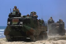 Marines with Company A, 3d Assault Amphibian Battalion, 1st Marine Division, maneuver their Amphibious Assault Vehicle to the shore aboard Marine Corps Base Camp Pendleton, Calif., after exiting the well deck of amphibious transport dock ship USS New Orleans (LPD18),  during a training exercise, Aug. 22, 2015. The purpose of the training was to provide surf qualification training for the battalion’s crew members. (U.S. Marine Corps photo by Staff Sgt. Bobbie A. Curtis)
