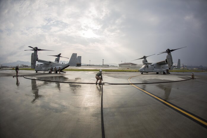 Marines with Marine Aerial Refueler Transport Squadron(VMGR) 152 refuel MV-22B Osprey tiltrotor aircrafts with Marine Medium Tiltrotor Squadron 262, during air delivery ground refueling training aboard Marine Corps Air Station Iwakuni, Japan, Aug. 20, 2015. The KC-130J aircraft is capable of carrying more than 12,000 gallons of fuel and simultaneously refueling two aircraft at 300 gallons a minute. This ability, along with many others, makes VMGR-152 and their aircraft an important asset to Marine Corps’ aviation.