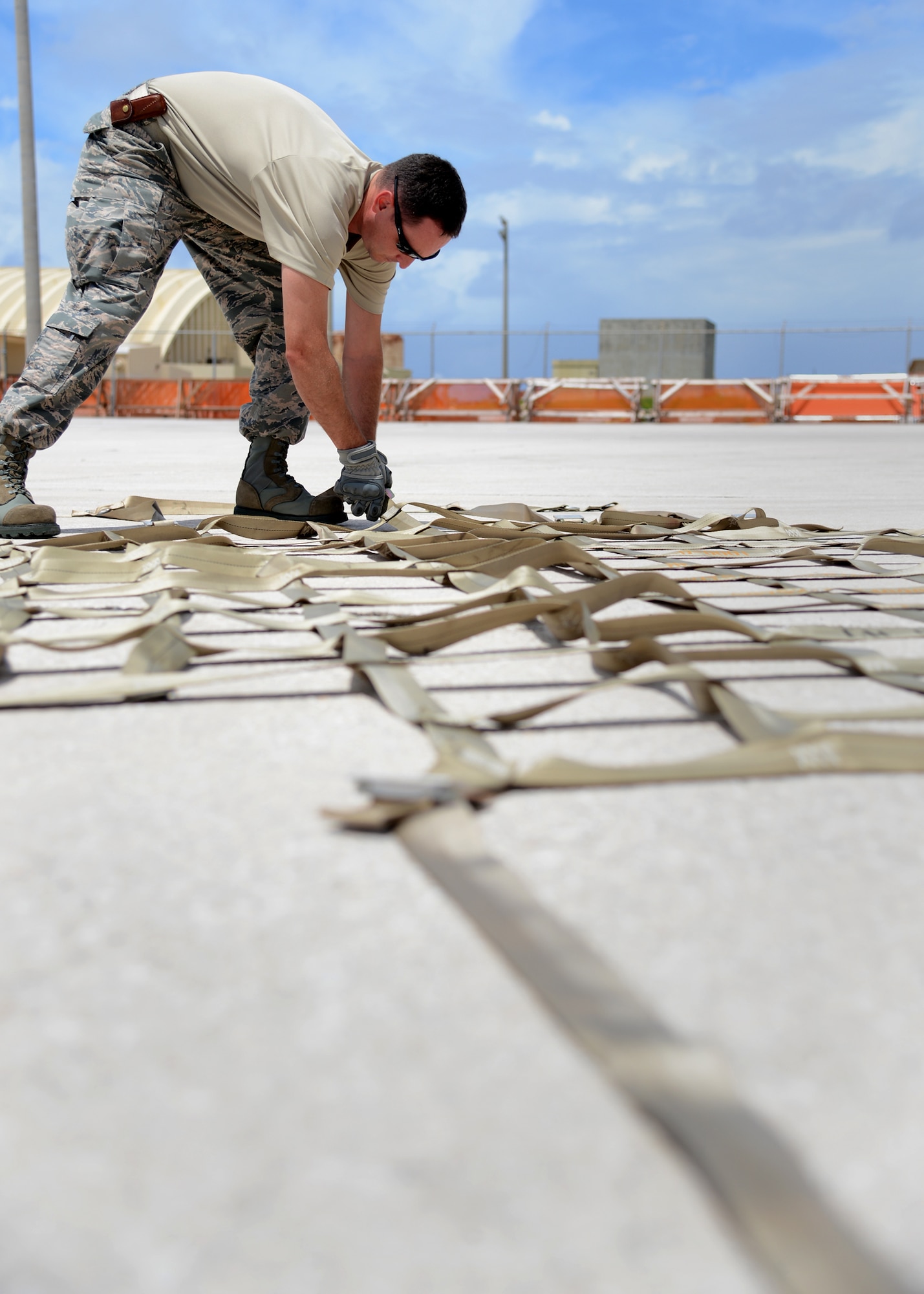 U.S. Air Force Master Sgt. Daniel Jirsa (left), 509th Logistics Readiness Squadron NCO in charge of plans and integration, and Tech. Sgt. Tavis Riley, 509th LRS cargo deployment function craftsman both deployed from Whiteman Air Force Base, Missouri, work together to move pallets at Andersen Air Force Base, Guam, Aug. 19, 2015. Deployments like these support the Department of Defense portion of the whole-of-U.S. Government rebalance to the Indo-Asia-Pacific region. (U.S. Air Force photo by Senior Airman Joseph A. Pagán Jr./Released)