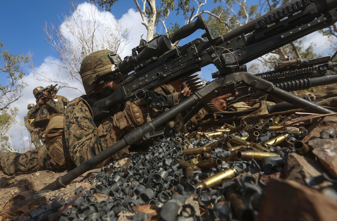 U.S. Marine Corps Lance Cpl. Noah Soliz fires his M240-B medium machine gun during a live-fire squad attack course August 22 during Exercise Crocodile Strike at Mount Bundey Training Area, Northern Territory, Australia. Marines with Marine Rotational Force – Darwin are conducting bilateral training with the Australian Defence Force for two weeks, including dry and live-fire exercises with air and ground elements. The rotational deployment of U.S. Marines affords an unprecedented combined training opportunity with our Australian allies and improves interoperability between our forces. Soliz is a machine gunner with Company C, 1st Battalion, 4th Marine Regiment, MRF-D.