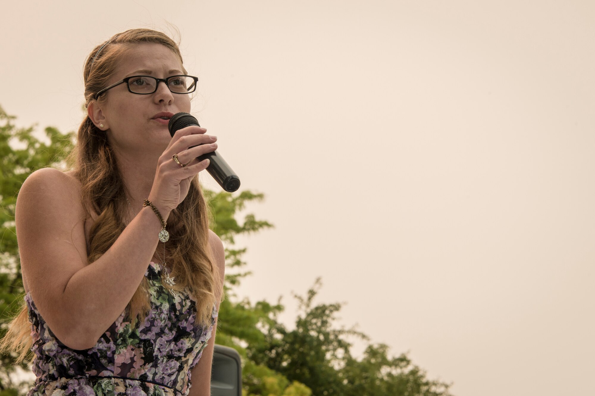 Staff Sgt. Danielle Fulgham, 336th Training Support Squadron network support technician, sings “One and Only” by Adele during the AMC Icon local vocal competition Aug. 20, 2015, in Miller Park at Fairchild Air Force Base, Wash. The AMC Icon program is loosely based around the hit TV program, American Idol, and allows local contestants to compete for $1,000 in cash prizes. The top active duty Air Force vocalist will then compete for $2,000 in cash prizes at the command level. Fulgham earned third place in Fairchild Air Force Base’s competition winning $200 cash. (U.S. Air Force photo/Staff Sgt. Benjamin W. Stratton)