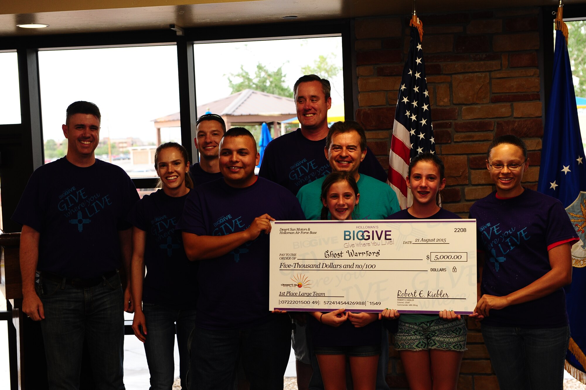 Members from Team Ghost Warriors receive the large team first place award of $5,000 at the Big Give after party on Aug 21.This year’s Big Give consisted of 540 volunteers in 40 teams working a total of 7,292 hours and saving the community $458,431.98. 