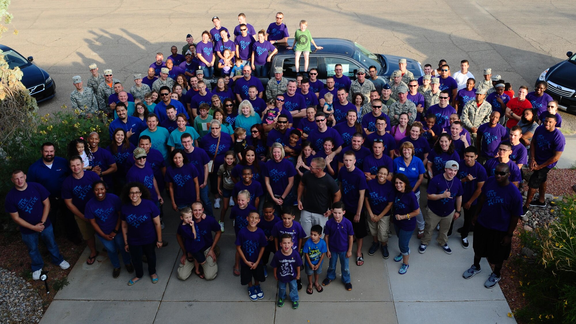 Participants in this year’s Big Give pose for a photo outside Club Holloman at the Big Give after party on Aug 21.This year’s Big Give consisted of 540 volunteers in 40 teams working a total of 7,292 hours and saving the community $458,431.98. 