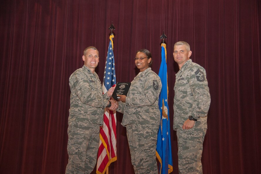 Master Sgt. Jennifer Nalls, 92nd Contracting Squadron superintendent and first sergeant, receives the 92nd Air Refueling Wing Senior NCO of the Quarter award Aug. 24, 2015, at Fairchild Air Force Base, Wash. (U.S. Air Force photo/Airman 1st Class Taylor Bourgeous)