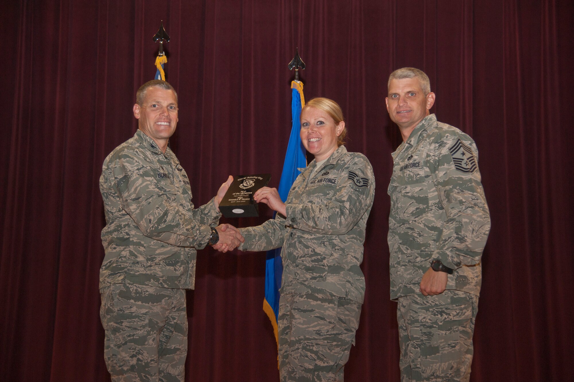 Staff Sgt. Veronica Montes, 92nd Air Refueling Wing Public Affairs media operations NCO in charge, receives the 92nd ARW NCO of the Quarter award Aug. 24, 2015, at Fairchild Air Force Base, Wash. (U.S. Air Force photo/Airman 1st Class Taylor Bourgeous)