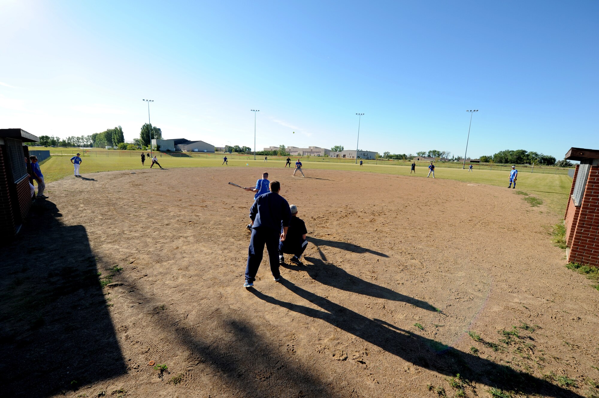 Staff Sgt. Ryan Kuhn, 319th Air Base Wing Honor Guard NCO-in-charge, hits a shot up the middle during the Intramural Softball Championship game August 24, 2015, on Grand Forks Air Force Base, North Dakota. The 319th Communications Squadron lost to the 69th Reconnaissance Group by a score of four to one. (U.S. Air Force photo by Airman 1st Class Ryan Sparks/Released)