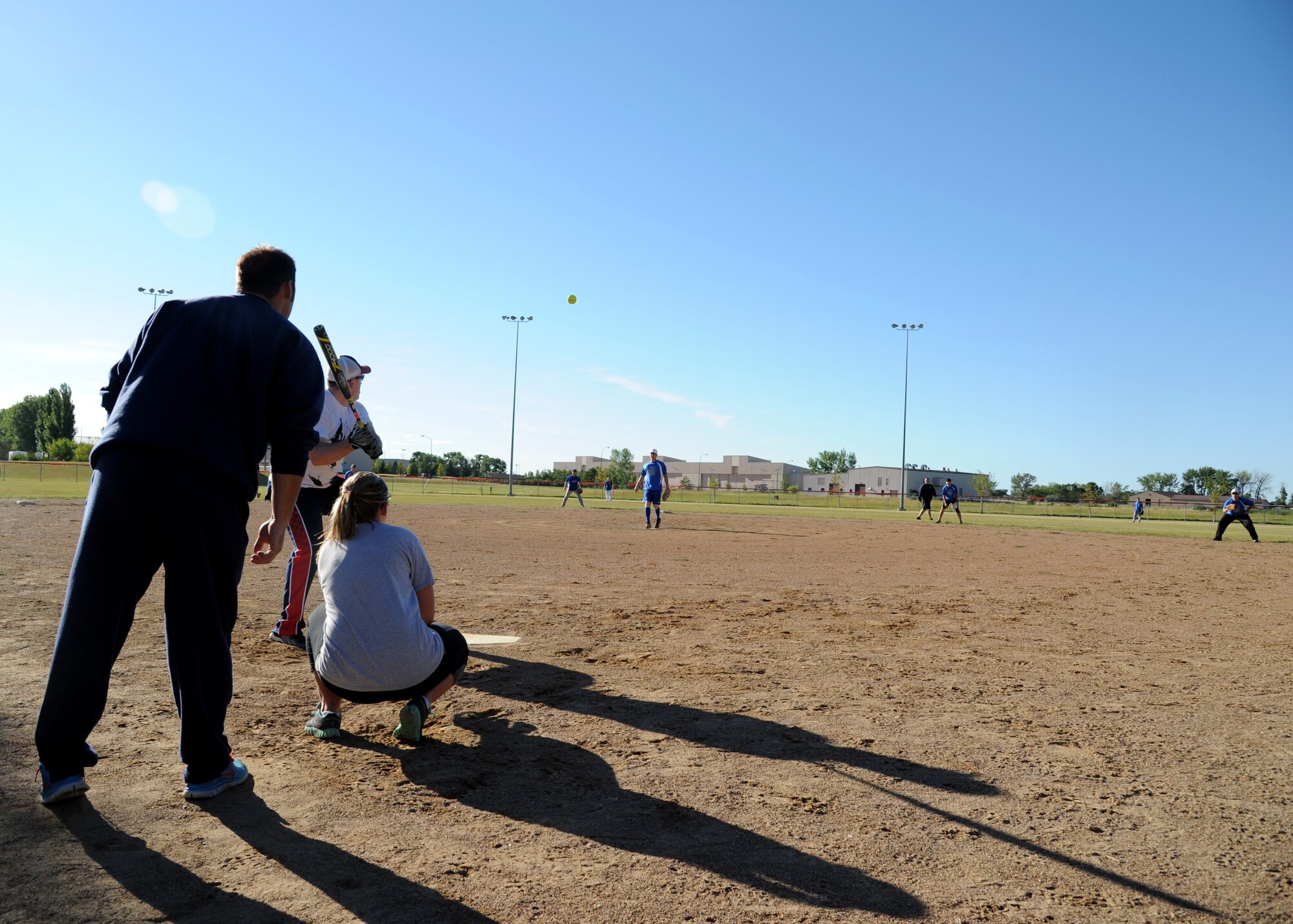 Airmen from the 319th Communications Squadron prepare for a hit during the Intramural Softball Championship game August 24, 2015, on Grand Forks Air Force Base, North Dakota. The 69th Reconnaissance Group beat the 319th Communications Squadron by a score of four to one. (U.S. Air Force photo by Airman 1st Class Ryan Sparks/Released)