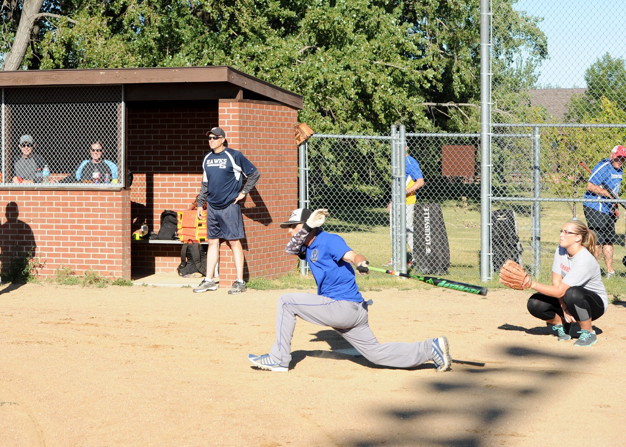 Staff Sgt. Jason Richmond, 69th Maintenance Squadron quality assurance inspector, swings the bat during the Intramural Softball Championship game August 24, 2015, on Grand Forks Air Force Base, North Dakota. Richmond was the head coach of the 69th Reconnaissance Group team who won the championship. (U.S. Air Force photo by Airman 1st Class Ryan Sparks/Released)