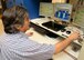ALTUS AIR FORCE BASE, Okla. – Bill Thomson, 97th Operations Support Squadron radar electronics technician, returns the digital air surveillance radar to online status after troubleshooting an antennae polarization issue, Aug. 24, 2015. Air traffic controllers use this radar to figure out the location, direction, speed and altitude of aircraft.   (U.S. Air Force photo by Airman 1st Class Megan E. Acs/Released) 