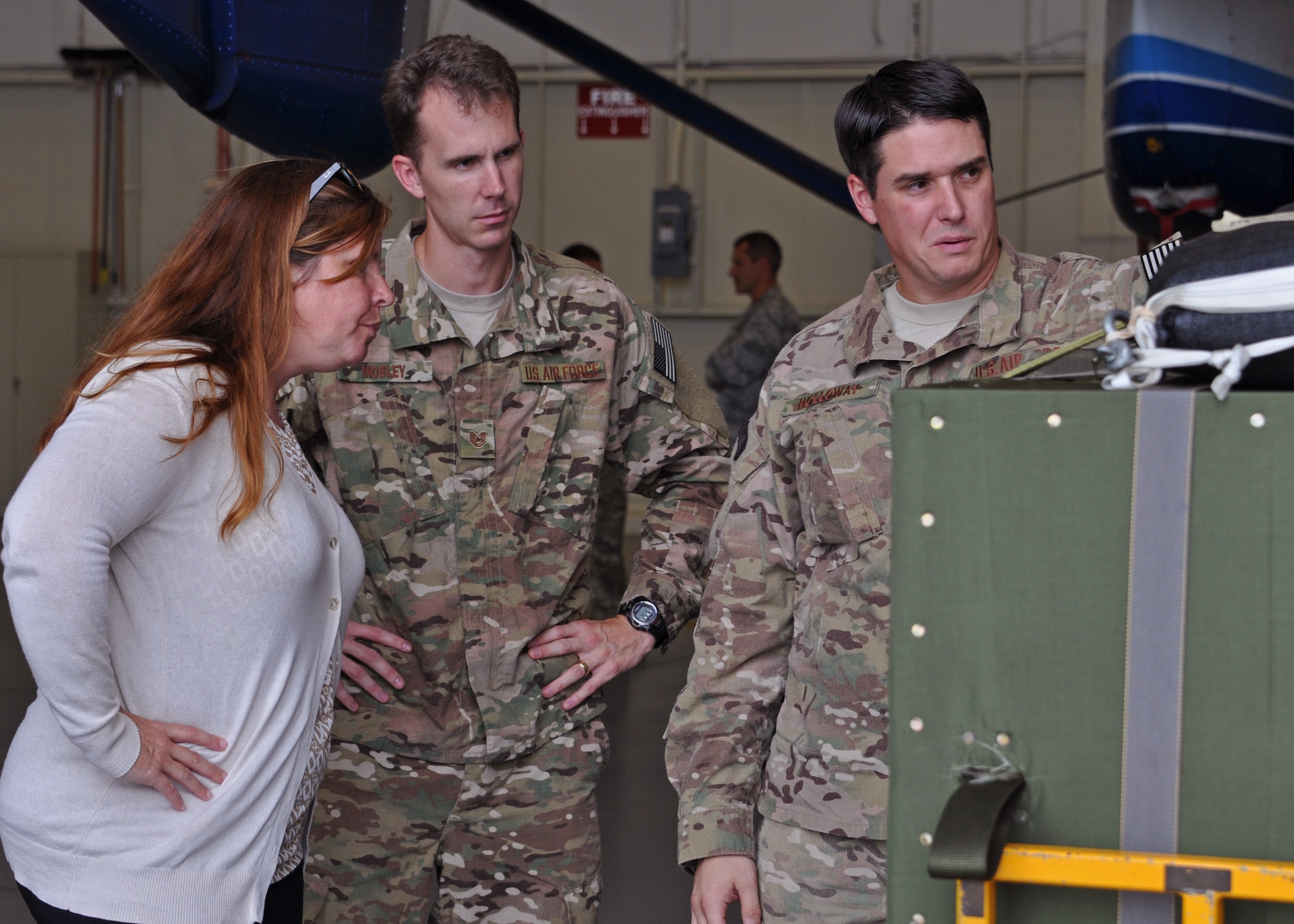 Cathy Haverstock, the Military Legislative Assistant to Sen. Bill Nelson of Florida, visits with Tech. Sgt. Justin Holloway, a 711th Special Operations Squadron combat aviation advisor, as he discusses the C-145 aerial delivery system at Duke Field, Fla., Aug. 19.   Haverstock toured the base and received key updates on the evolving 919th Special Operations Wing mission. (U.S. Air Force photo/Dan Neely)