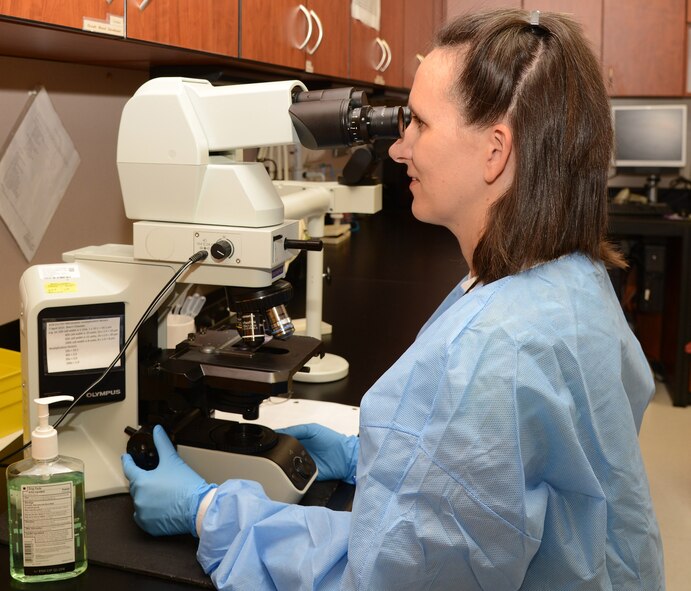 Sherri Chastain, 56th Medical Support Squadron clinical laboratory scientist, checks samples for diseases and infections through a microscope Aug. 25 at Luke Air Force Base, Arizona. The 56th MDSS provides administrative, financial, diagnostic and therapeutic services that are essential to health promotion and health care for more than 84,000 beneficiaries. (U.S. Air Force photo by Airman 1st Class Cory Gossett)