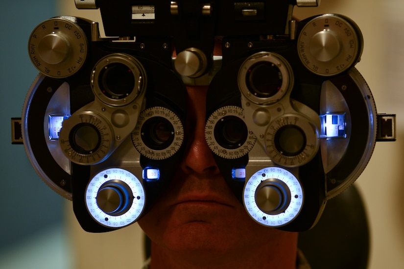 U.S. Army Col. Glenn Hodges, U.S. Army Training and Doctrine Command Army Capabilities Integration Center human performance and learning analyst, undergoes an annual eye exam at the McDonald Army Health Center Eye Clinic at Fort Eustis, Va., Aug. 21, 2015. Hodges’ exam included checking his eyes for glaucoma and issuing him a prescription for glasses. (U.S. Air Force photo by Staff Sgt. Natasha Stannard/Released)