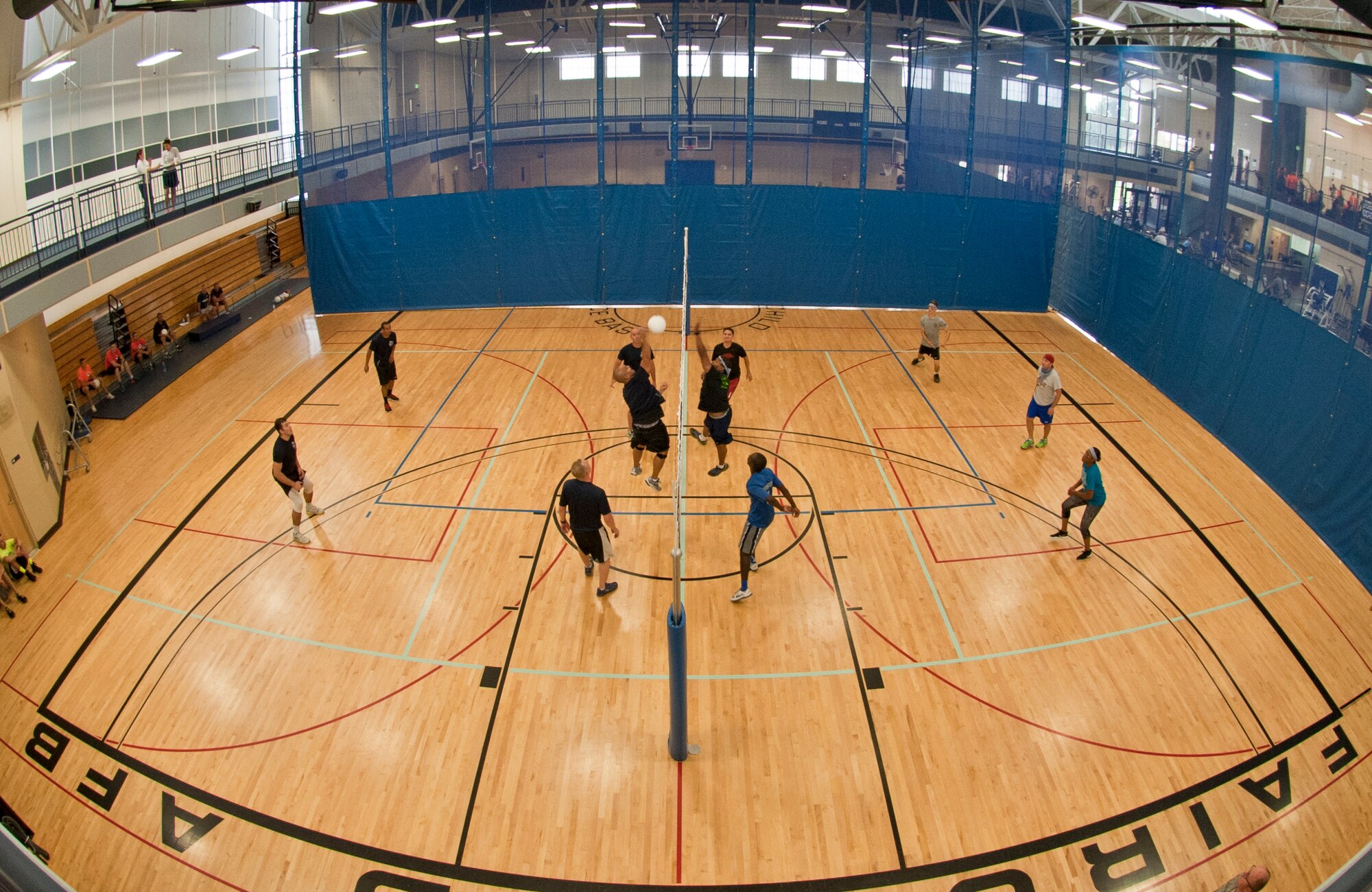Members of the 92nd Contracting Squadron face off against 92nd Operations Support Squadron members during a volleyball tournament as part of Summer Sports Day Aug. 20, 2015, at Fairchild Air Force Base, Wash. Fairchild hosted a Summer Sports Day in which Airmen and their families competed in sports and built unit morale. (U.S. Air Force photo/Staff Sgt. Veronica Montes)