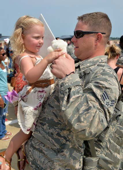 An Airman is greeted by a child upon returning from a six-month deployment to Andersen Air Force Base, Guam, at Barksdale Air Force Base, La., Aug. 24, 2015. The U.S. conducts CBP operations as part of a routine, forward-deployed, global strike capability supporting regional security and our allies in the Indo-Asia-Pacific region. (U.S. Air Force photo/Airman 1st Class Mozer O. Da Cunha)