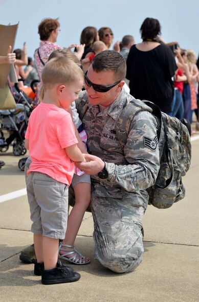 Staff Sgt. Michael James, 2nd Munitions Squadron munitions operation supervisor, is greeted by his children after a six-month deployment to Guam, at Barksdale Air Force Base, La., Aug. 24, 2015. Barksdale is one of three Air Force Global Strike Command bases that support the CBP in the Indo-Asia-Pacific region including Minot Air Force Base, N.D., and Whiteman Air Force Base, Mo. James is a native of Batavia, Ohio. (U.S. Air Force photo/Airman 1st Class Mozer O. Da Cunha)
