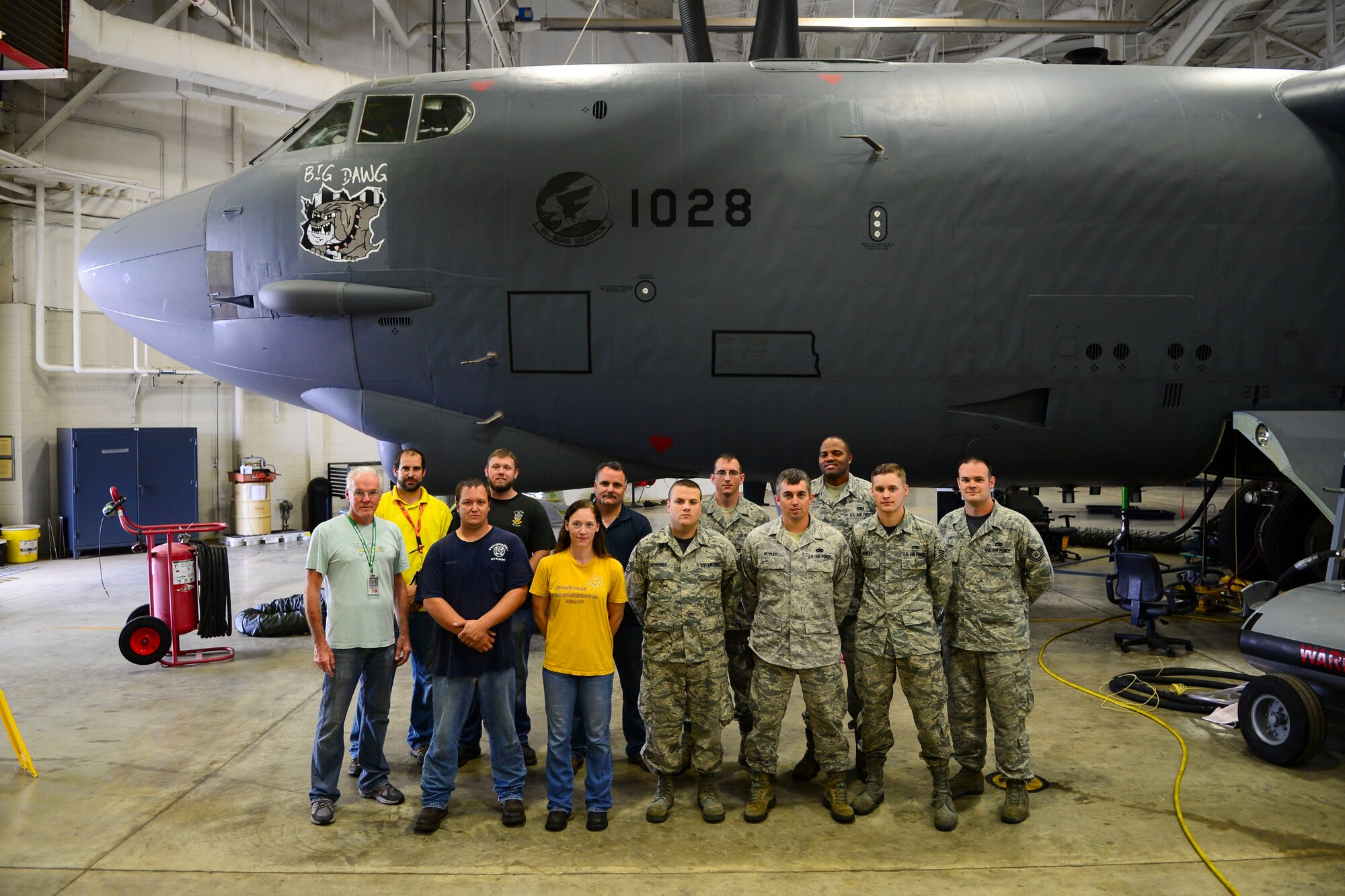 Fuels Airmen from the 2nd Maintenance Squadron and Tinker Air Force Base, Okla., aircraft mechanics pose for a photo at Barksdale Air Force Base, La., Aug. 21, 2015. A Minot AFB, N.D., B-52 Stratofortress’ chronic fuel leak brought Barksdale maintainers and Tinker AFB, Okla., aircraft technicians together over the last five weeks to resolve the problem. (U.S. Air Force photo/Senior Airman Benjamin Raughton)