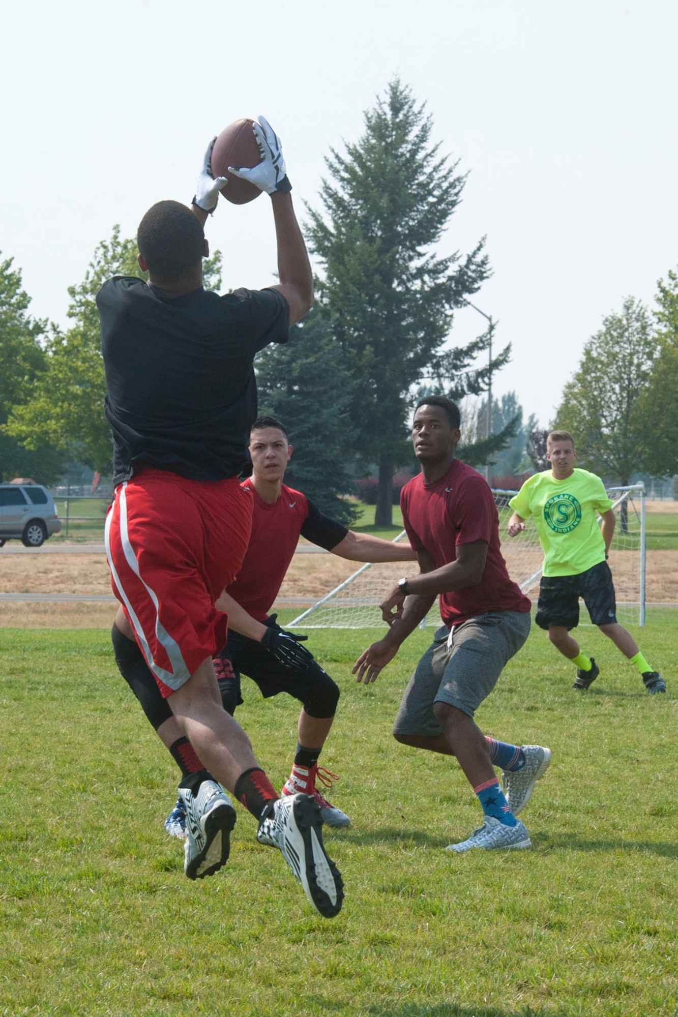 Members of the 92nd Force Support Squadron compete against members of the 92nd Operations Group in an Ultimate Football tournament during Summer Sports Day Aug 20, 2015, at Fairchild Air Force Base, Wash. The tournament consisted of numerous teams competing for the Summer Sports Day Trophy. (U.S. Air Force photo/ Airman 1st Class Mackenzie Richardson)