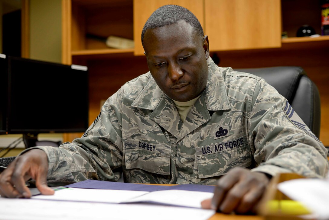 Chief Master Sgt. Freddie Dorsey, 28th Logistics Readiness Squadron superintendent, completes administrative tasks at Ellsworth Air Force Base, S.D., July 23, 2015. Dorsey brings substantial institutional, operational and functional experience, as well as strong leadership skills, to the 28th LRS and all assigned tasks. (U.S. Air Force photo by Senior Airman Anania Tekurio/Released)