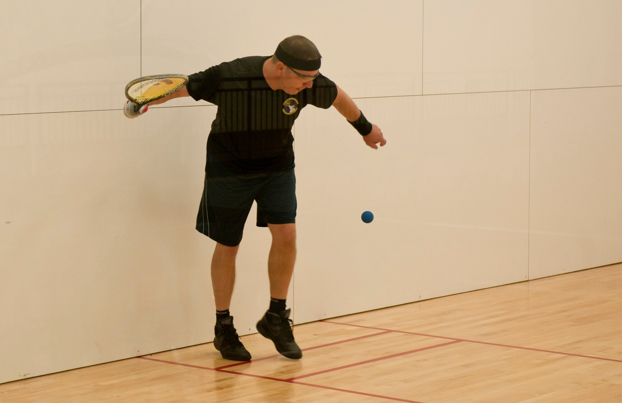 Senior Master Sgt. Chirstopher Gibson, 92nd Logistics Readiness Squadron fuels superintendent, plays in a game of racquetball during Summer Sports Day Aug. 20, 2015, at Fairchild Air Force Base, Wash. Gibson’s team completed the racquetball tournament in 2nd place. (U.S. Air Force Photo/Airman Sean Campbell)
