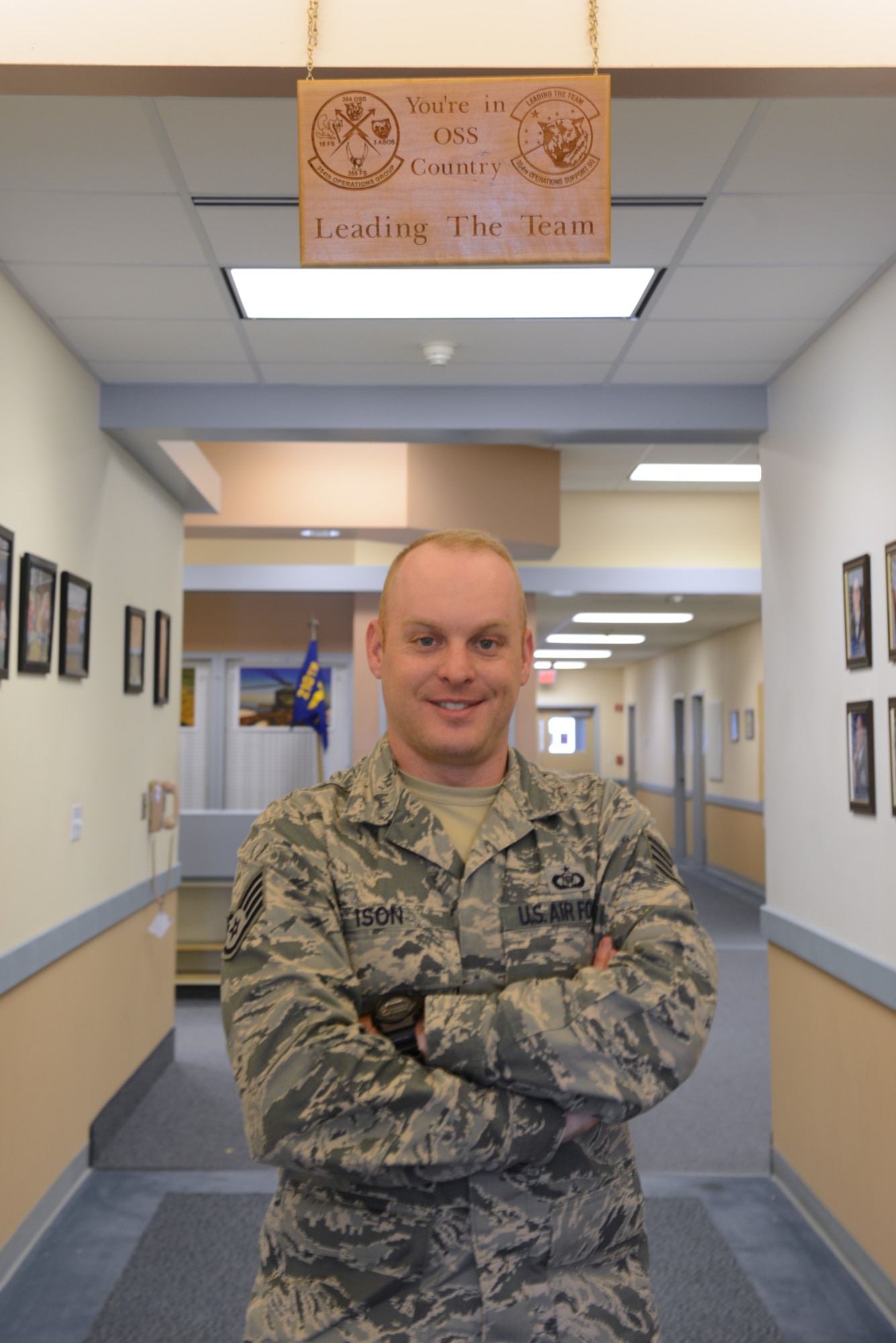 U.S. Air Force Staff Sgt. Matthew Ison, the 354th Operations Support Squadron noncommissioned officer in-charge of current operations, stops work for a brief photo in the OSS building Aug. 19, 2015, at Eielson Air Force Base, Alaska. Ison said his favorite part of the job is interacting with aircrew members on a daily basis. (U.S. Air Force photo by Senior Airman Ashley Nicole Taylor/Released)