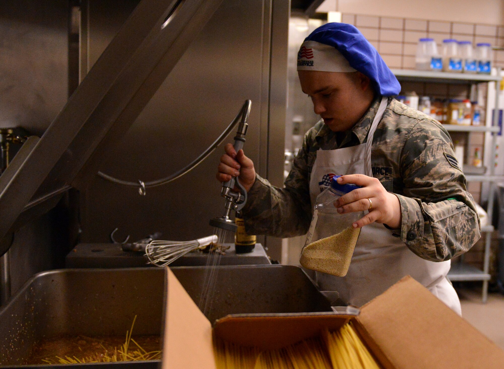 U.S. Air Force Senior Airman Adam Clark, a 354th Force Support Squadron sous chef, prepares yakisoba for the dinner rush Aug. 18, 2015, during RED FLAG-Alaska (RF-A) 15-3 at the Two Seasons Dining Facility on Eielson Air Force Base, Alaska. During RF-A, the facility dishes out more than 1,400 meals per day, three times its normal support rate of 300 to 400 meals. (U.S. Air Force photo by Airman 1st Class Kyle Johnson/Released)