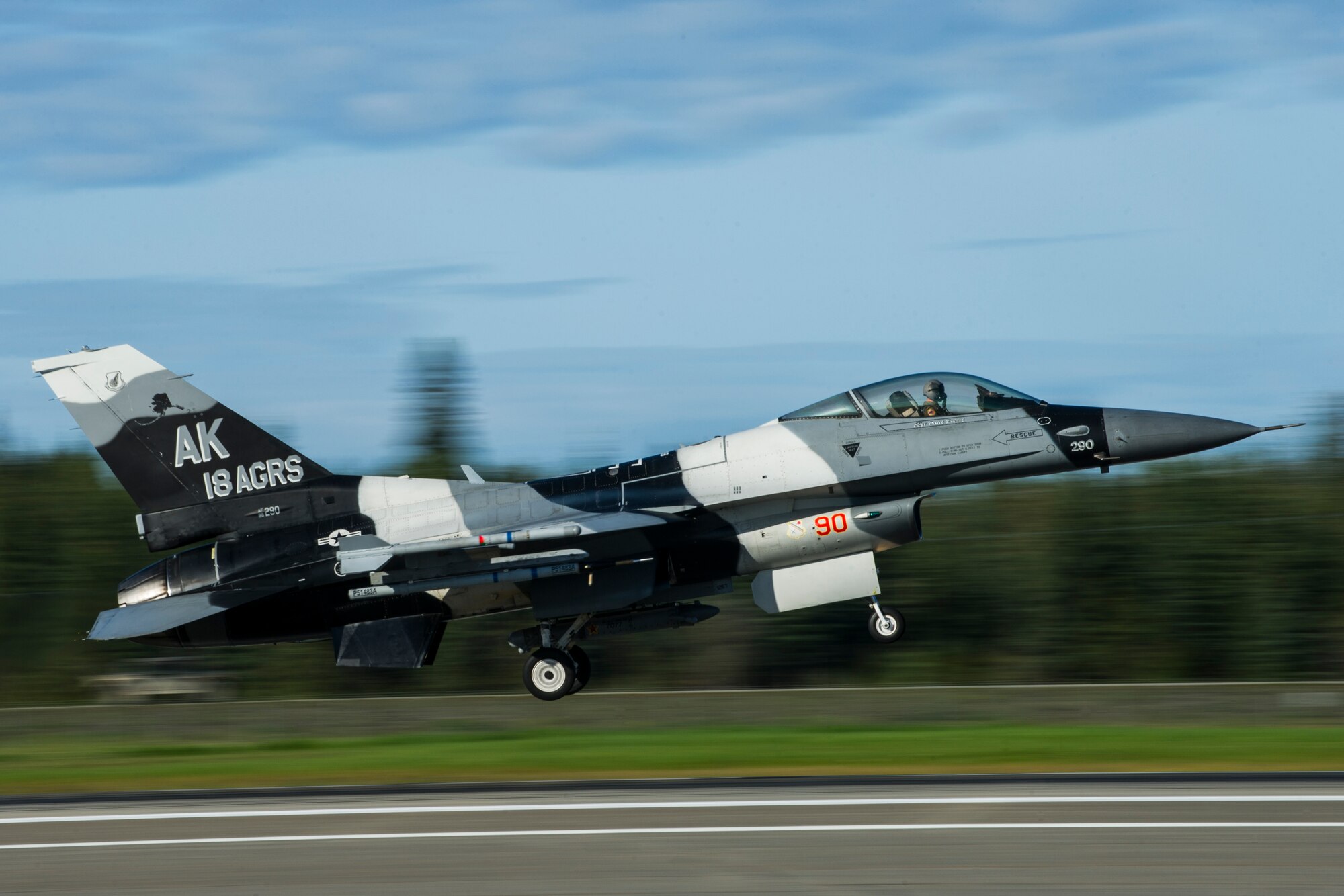 A U.S. Air Force F-16 Fighting Falcon assigned to the 18th Aggressor Squadron takes off from Eielson Air Force Base, Alaska, Aug. 21, 2015, during RED FLAG-Alaska (RF-A) 15-3. RF-A is a series of Pacific Air Forces commander-directed field training exercise for U.S. and partner nation forces, providing combined offensive counter-air, interdiction, close air support and large force employment training in a simulated combat environment. (U.S. Air Force photo by Staff Sgt. Joshua Turner/Released)