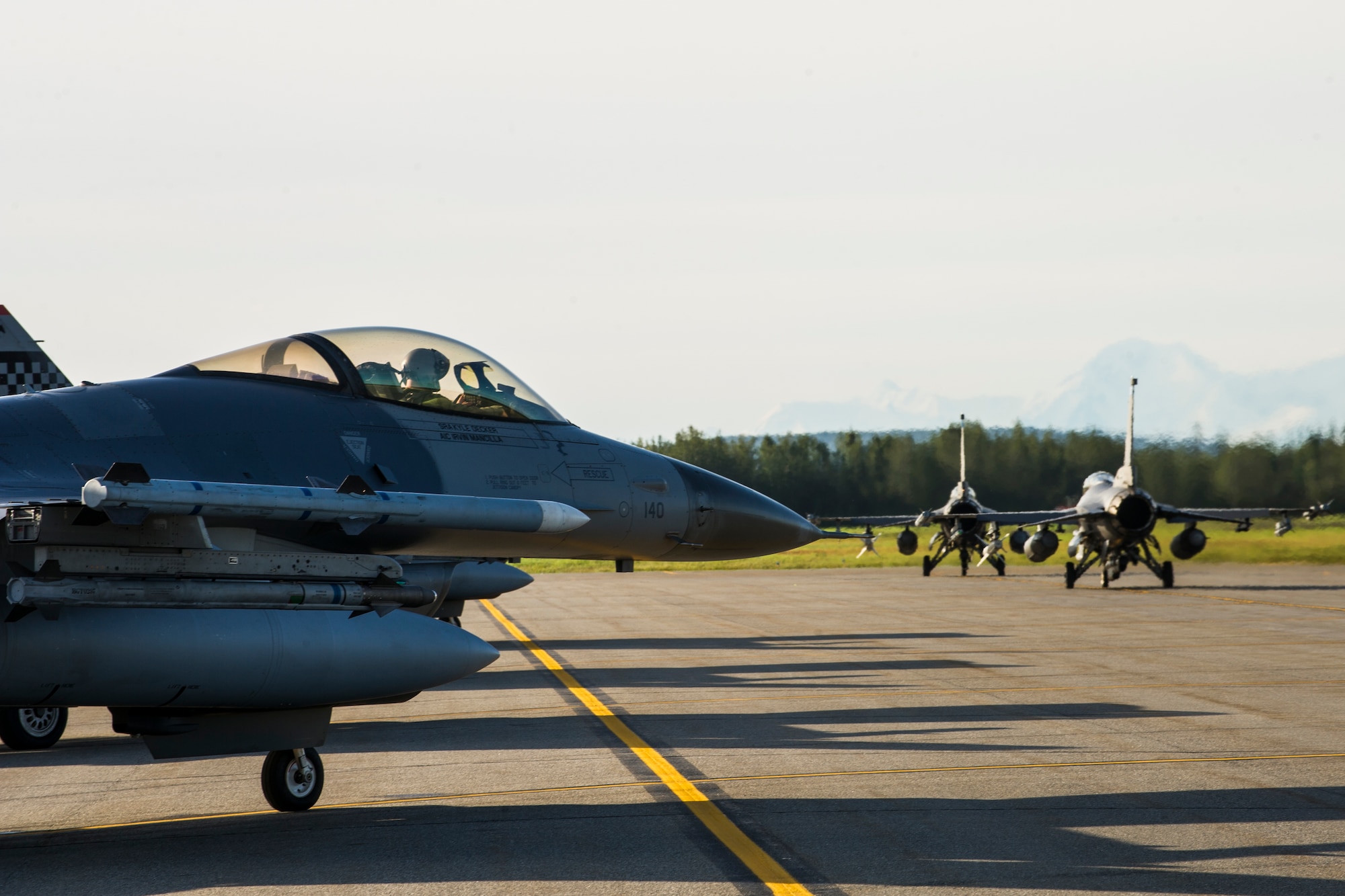 U.S. Air Force F-16 Fighting Falcons from the 36th Fighter Squadron out of Osan Air Base, Republic of Korea, taxi on the flightline at Eielson Air Force Base, Alaska, Aug. 21, 2015, during RED FLAG-Alaska (RF-A) 15-3. RF-A is a series of Pacific Air Forces commander-directed field training exercise for U.S. and partner nation forces, providing combined offensive counter-air, interdiction, close air support and large force employment training in a simulated combat environment. (U.S. Air Force photo by Staff Sgt. Joshua Turner/Released)