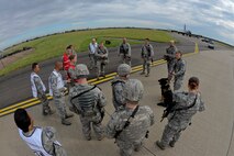 U.S. Air Force Airmen from the 100th Air Refueling Wing Inspector General’s Office debrief first responders after an exercise Aug. 24, 2015, on RAF Mildenhall, England. The exercise was conducted to test emergency responders and base personnel on their response to and recovery of a simulated KC-135 Stratotanker hijacking. (U.S. Air Force photo by Staff Sgt. Micaiah Anthony/Released)