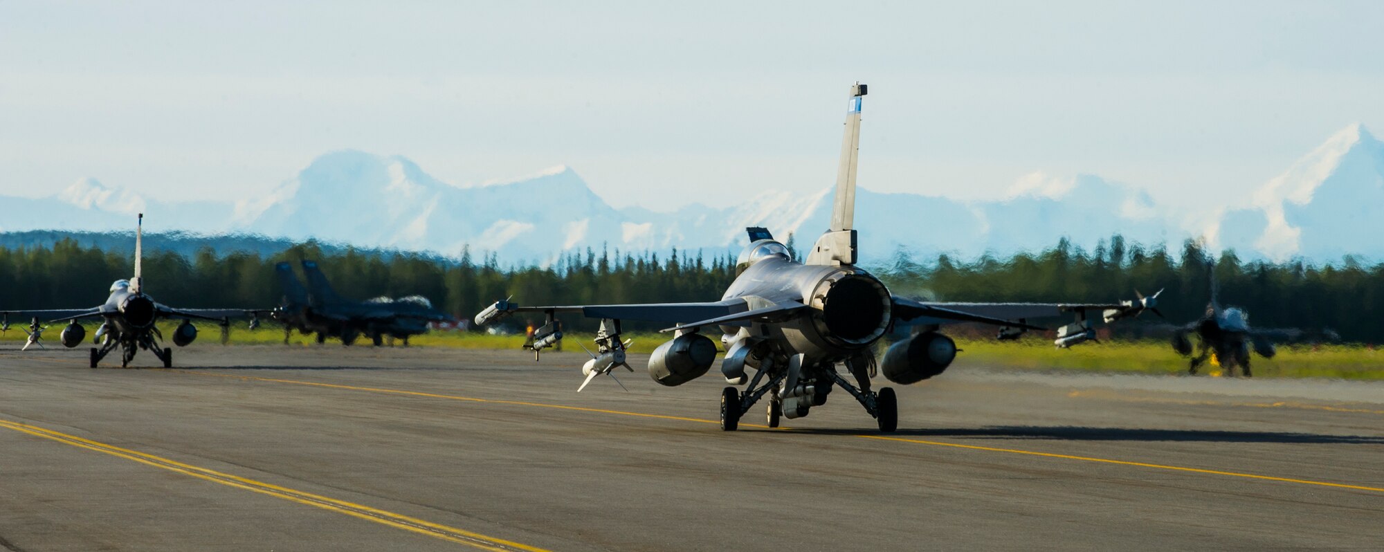 U.S. Air Force F-16 Fighting Falcons assigned to the Minnesota Air National Guard’s 148th Fighter Wing out of Duluth, Minn., taxi on the flightline at Eielson Air Force Base, Alaska, Aug. 21, 2015, during RED FLAG-Alaska (RF-A) 15-3. RF-A is a series of Pacific Air Forces commander-directed field training exercise for U.S. and partner nation forces, providing combined offensive counter-air, interdiction, close air support and large force employment training in a simulated combat environment. (U.S. Air Force photo by Staff Sgt. Joshua Turner/Released)