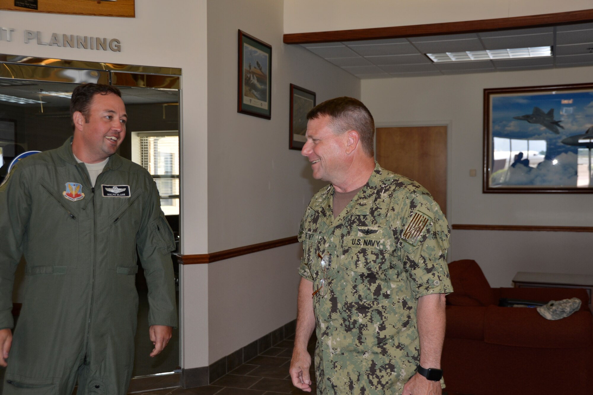 Adm. Bill Gortney, Commander, North American Aerospace Defense Command-U.S. Northern Command, talks with Lt. Col. Ralph Clark, 601st Air Operations Center’s Air Mobility Control Team Chief, during the admiral’s  visit to Continental U.S. Aerospace Defense Region – 1st Air Force (Air Forces Northern) Aug. 12. During his visit, the admiral toured organizational facilities, met with CONR- 1st AF (AFNORTH) leadership and received briefings about the status of current issues. (U.S. Air Force photo released/Mary McHale)