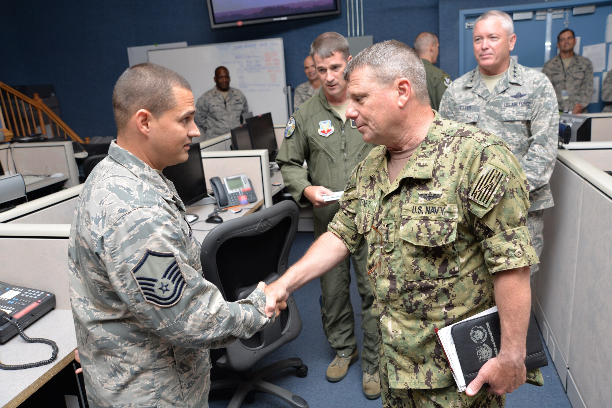 During a visit to the 601st Air Operations Center Aug. 12, Adm. Bill Gortney, Commander, North American Aerospace Defense Command-U.S. Northern Command, presented his coin to Master Sgt. Brad Weekley, 101st Air Communications Squadron, for outstanding duty performance.  Along with a tour and meetings at the 601st AOC, the admiral also met with senior Air Forces Northern leadership and received briefings about the status of current issues. (U.S. Air Force photo released/Capt. Jared Scott)