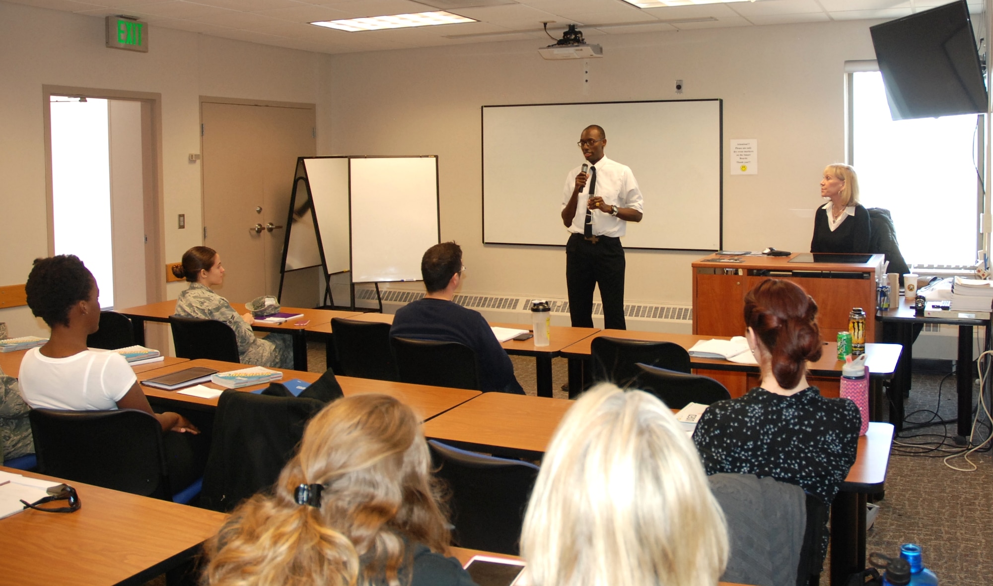 PETERSON AIR FORCE BASE, Colo. - Senior Airman Jeremiah Farmer, 50th Security Forces Squadron, gives a wedding speech to classmates in a speech and public speaking class offered at Peterson Air Force Base through Pikes Peak Community College. Farmer said the availability of classes on base at the education center makes it much easier for him to pursue his education with his busy schedule. (U.S. Air Force photo by Dave Smith)