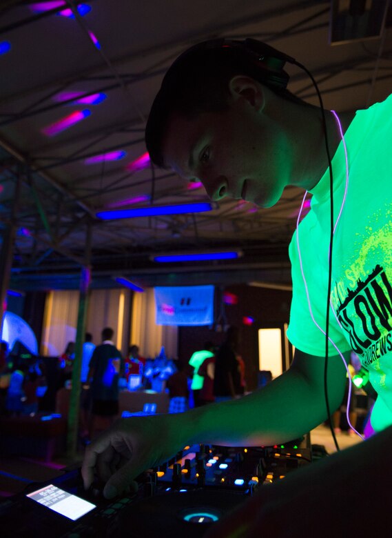 Airman Josh Krous, 11th Civil Engineer Squadron, deejays the after-party of the Ready.Set.Glow 5k inside the Community Commons on Joint Base Andrews, Md., Aug. 21, 2015. (U.S Air Force photo/Airman 1st Class Philip Bryant)