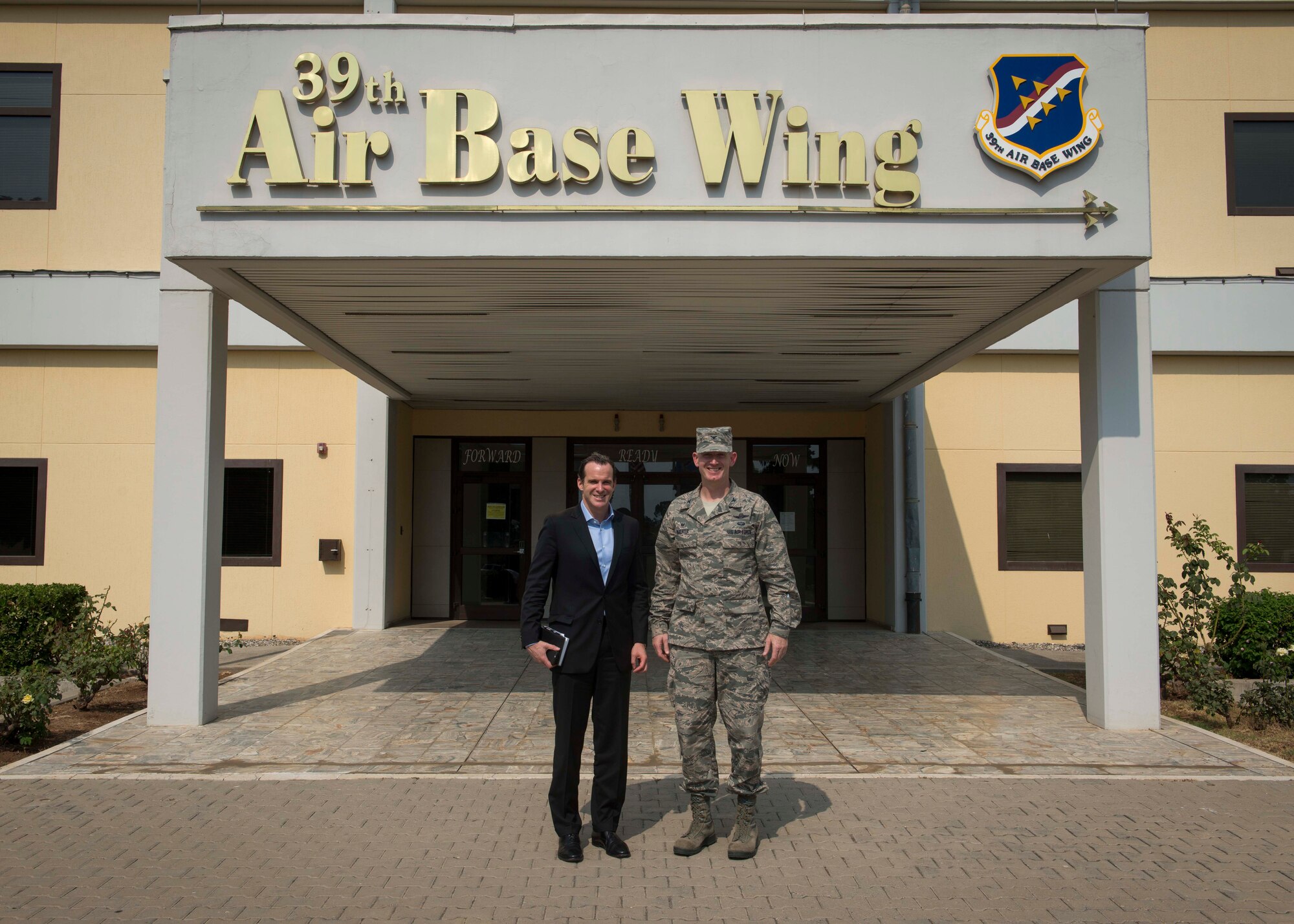 Brett H. McGurk, U.S. Ambassador, Deputy Special Presidential Envoy to the Global Coalition to Counter ISIL, and Col. John Walker, 39th Air Base Wing commander stand in front on the 39 ABW wing headquarters building Aug 14, 2015, at Incirlik Air Base, Turkey. McGurk serves as Ambassador, Deputy Special Presidential Envoy to the Global Coalition to Counter ISIL, and Deputy Assistant Secretary of State for Iraq and Iran, at the U.S. Department of State. (U.S. Air Force photo by Airman 1st Class Cory W. Bush/Released)