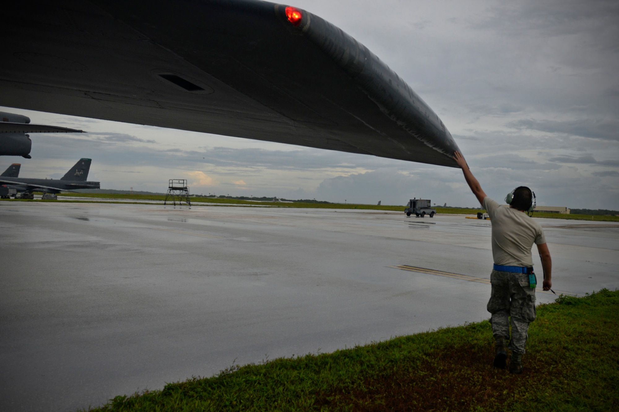 Staff Sgt. Stephen Cole, B-52 Stratofortress crew chief assigned to the 20th Expeditionary Aircraft Maintenance Squadron, gives his aircraft a final good-luck touch before takeoff Aug. 22, 2015, at Andersen Air Force Base, Guam. Bomber crews with the 20th Expeditionary Bomb Squadron are part of U.S. Pacific Command’s continuous bomber presence and support ongoing operations in the Indo-Asia-Pacific region. (U.S. Air Force photo by Staff Sgt. Alexander W. Riedel/Released)