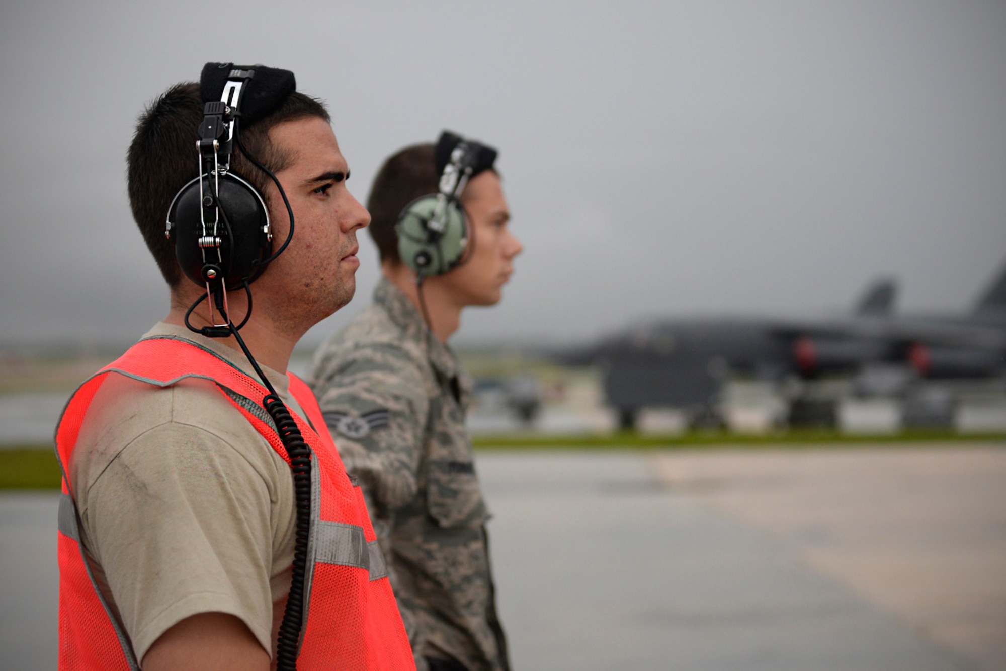 Senior Airmen Taylor Giordano, left, and Logan Turner, B-52 Stratofortress crew chiefs assigned to the 20th Expeditionary Aircraft Maintenance Squadron, observe their aircraft during preflight checks Aug. 22, 2015, at Andersen Air Force Base, Guam. Bomber crews with the 20th Expeditionary Bomb Squadron are part of U.S. Pacific Command’s continuous bomber presence and support ongoing operations in the Indo-Asia-Pacific region. (U.S. Air Force photo by Staff Sgt. Alexander W. Riedel/Released)