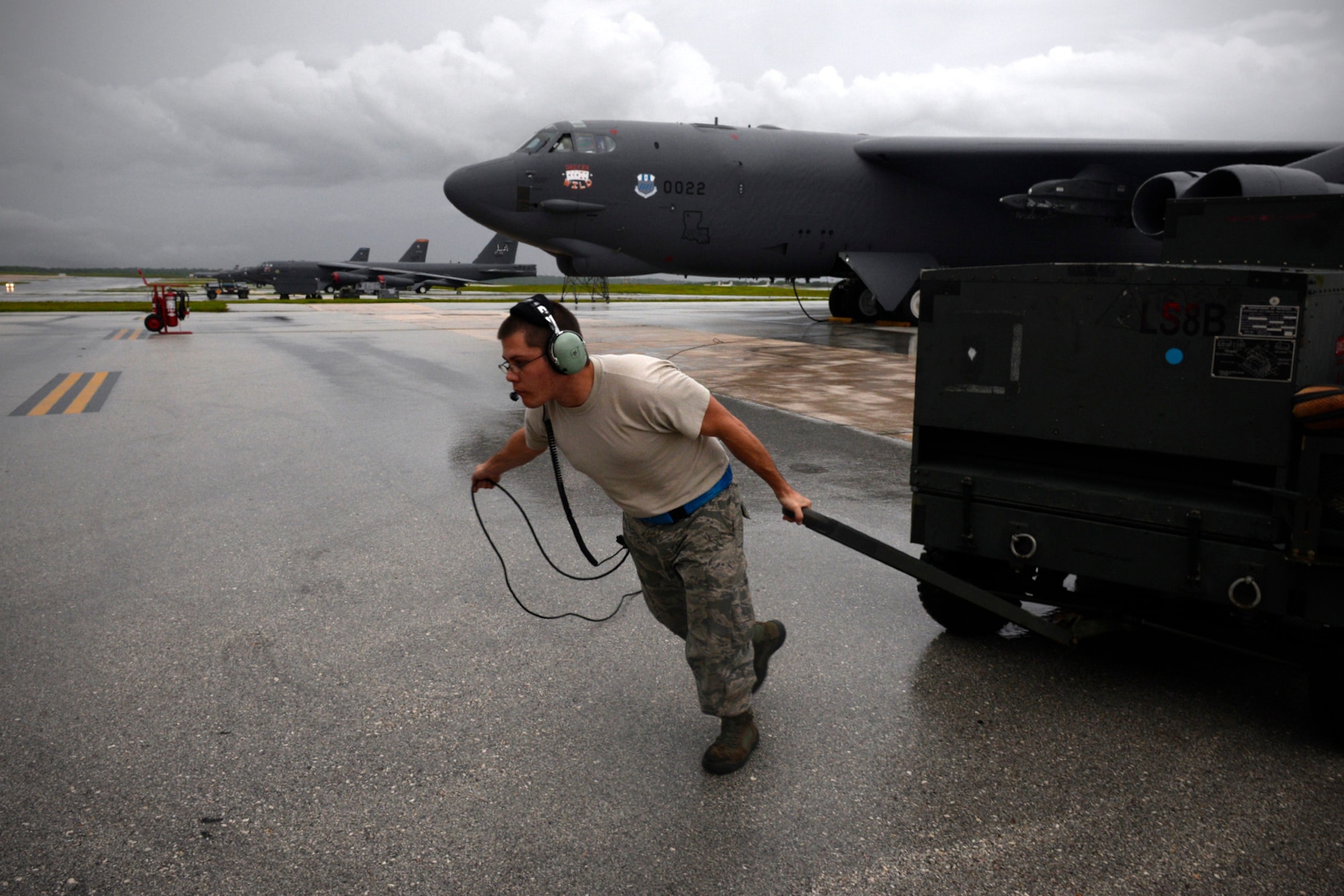 Staff Sgt. Stephen Cole, B-52 Stratofortress crew chief assigned to the 20th Expeditionary Aircraft Maintenance Squadron, moves ground equipment during aircraft launch operations Aug. 22, 2015, at Andersen Air Force Base, Guam.  Bomber crews with the 20th Expeditionary Bomb Squadron are part of U.S. Pacific Command’s continuous bomber presence and support ongoing operations in the Indo-Asia-Pacific region. (U.S. Air Force photo by Staff Sgt. Alexander W. Riedel/Released)