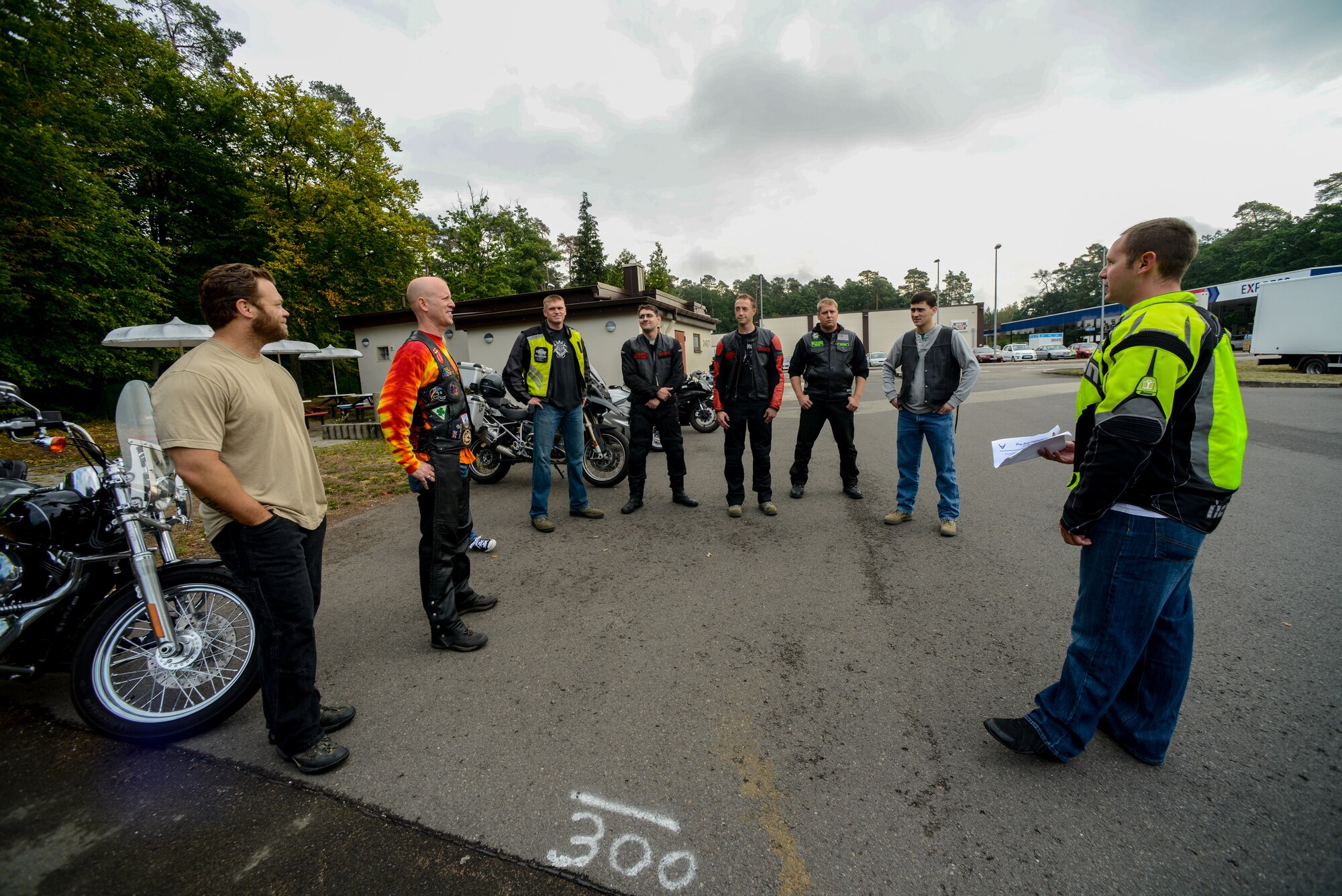 Tech. Sgt. Marc Warman 435th Contingency Response Group NCO in charge of current operations, explains a route before a motorcycle mentor ride Aug. 15, 2015, at Ramstein Air Base, Germany.  Newcomers received guidance from their mentors on riding in Europe, and experienced the difference between the U.S. and German roads. (U.S. Air Force photo/Senior Airman Nicole Sikorski)