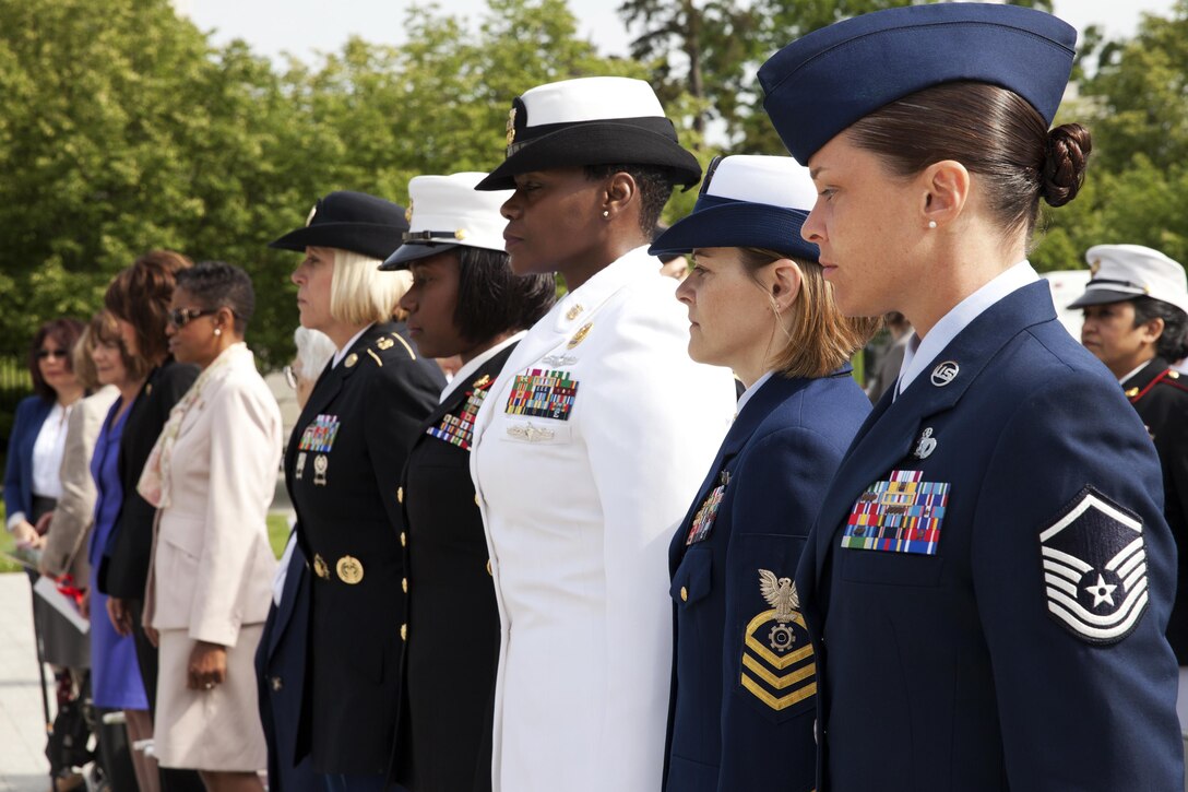Service members and civilian guests attend the 17th annual wreath-laying ceremony at the Women In Military Service For America Memorial in Arlington Va., May 20, 2014.