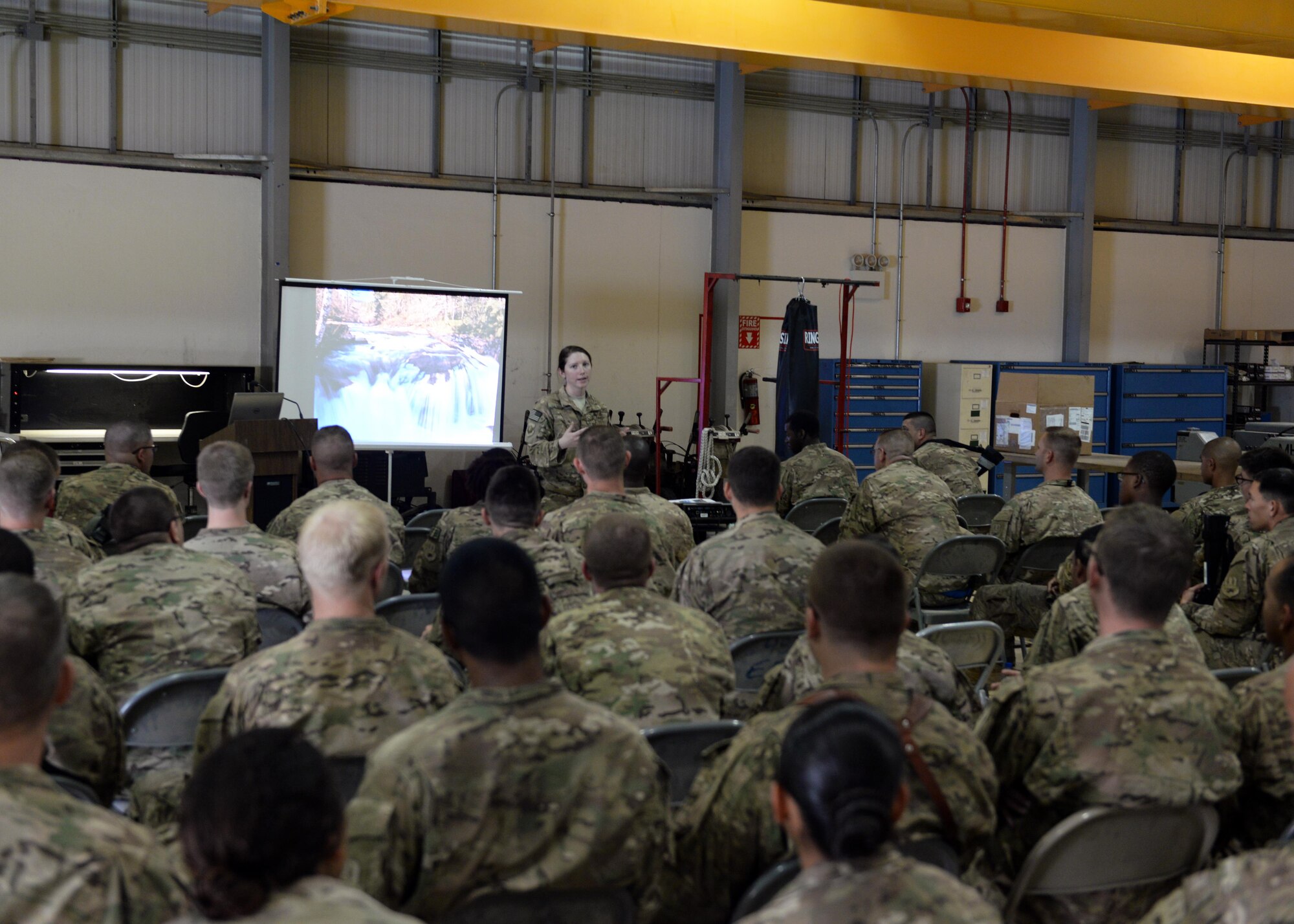U.S. Air Force Capt. Diana Hall, 455th Air Expeditionary Wing sexual assault response coordinator, gives a sexual assault prevention and response briefing to Airmen Aug. 25, 2015 at Bagram Airfield, Afghanistan. The SAPR briefing is mandatory for all Airmen and teaches how to prevent sexual assault and how to handle and respond to a situation. (U.S. Air Force photo by Senior Airman Cierra Presentado/Released)