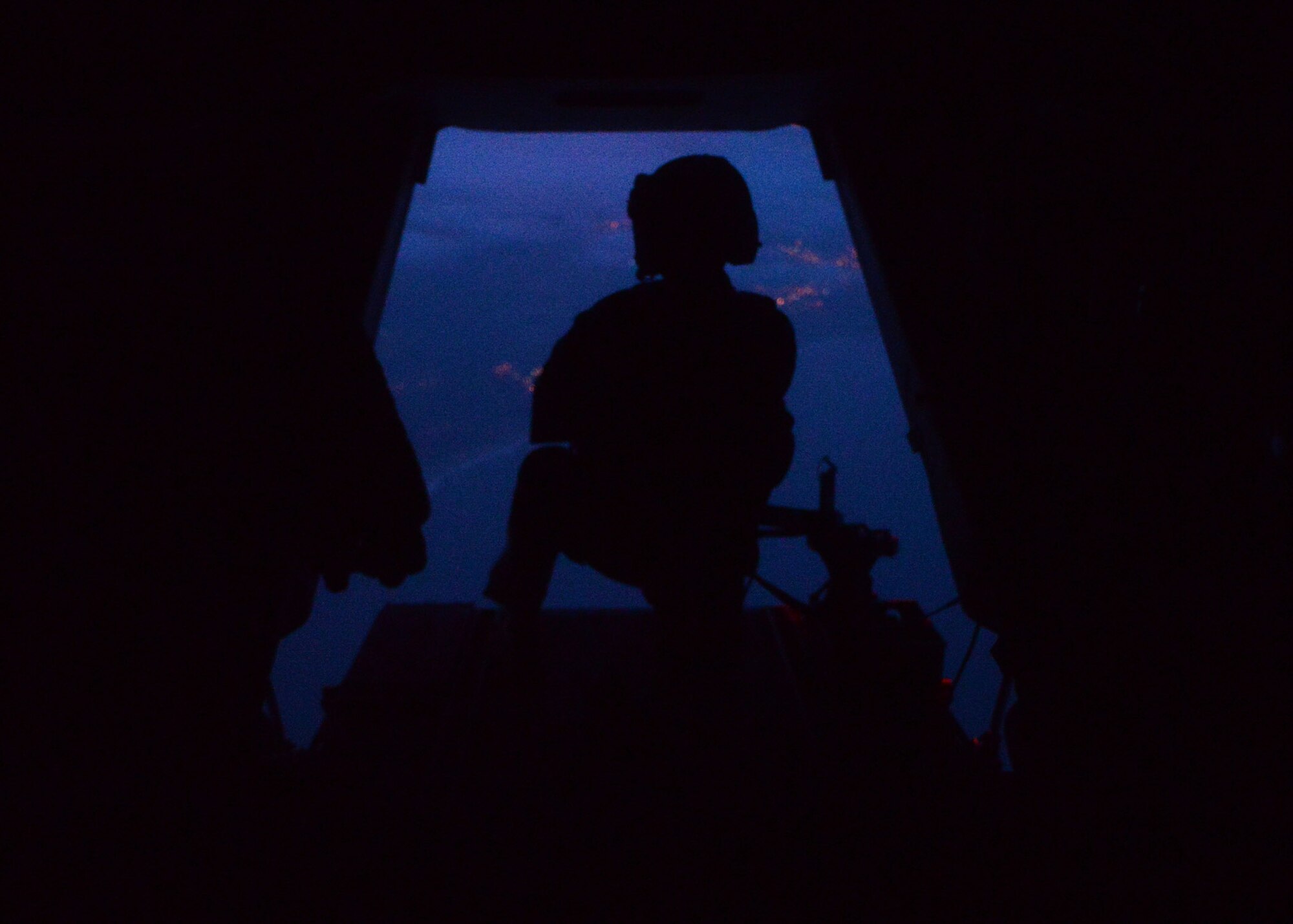 U.S. Air Force Adam Vogt, 7th Special Operations Squadron CV-22 Osprey Flight Engineer from Motley, Minn., practices scanning for threats Aug. 19, 2015, over England. Members from the 7th SOS and 352 Special Operations Support Squadron participated in Exercise Jackal Stone, an exercise designed to train Air Commandos on personnel recovery. (U.S. Air Force photo by Senior Airman Christine Halan/Released) 