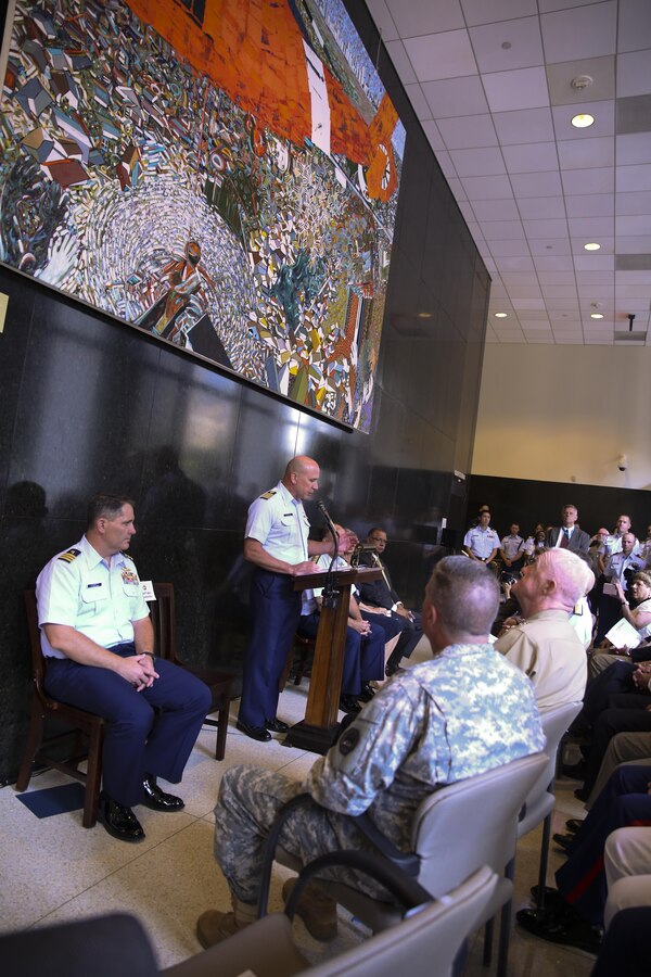 U.S. Coast Guard Capt. Mel Bouboulis, chief of staff of Eighth Coast Guard District, addresses the audience at the dedication ceremony for the painting titled “Rescue Me” by Louisiana artist Dale Fairbanks at the Hale Boggs Federal Building in New Orleans, La., Aug. 25, 2015. “Rescue Me” is based off of televised imagery of an MH-65 Dolphin helicopter rescuing stranded citizens in New Orleans’ Ninth Ward in the aftermath of Hurricane Katrina. The dedication ceremony was one of dozens of events this week commemorates the 10th anniversary of Hurricane Katrina on Aug. 29, 2015. 