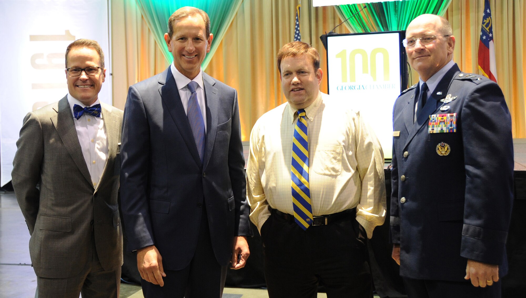 Lt. Gen. James F. Jackson with the guest speaker Dr. Frank Luntz, Pollster and  Communications Professional, and other attendees of the Georgia Chamber Congressional Luncheon where approximately 1,000 people from across the state 
of Georgia attended the annual event. (U.S. Air Force photo/Tech Sgt Mercedes Kimble Crossland)
