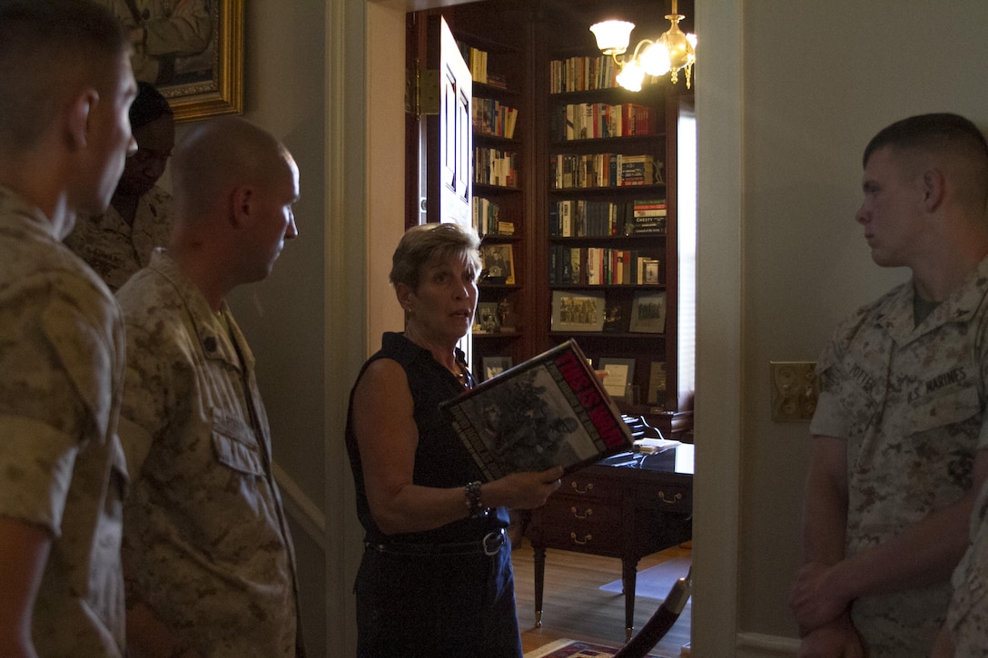 Ellyn Dunford, wife of Gen. Joseph Dunford, commandant of the Marine Corps, guides Marines from Marine Barracks Washington, D.C., through the Home of the Commandants during a tour, Aug. 26, 2015. (U.S. Marine Corps photo by Cpl. Skye Davis/Released)