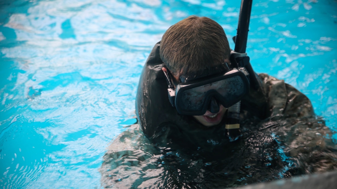 A Marine with 2nd Reconnaissance Battalion completes his third lap in a pool as he participates in the pre-dive course aboard Camp Lejeune, N.C., Aug. 18, 2015. The course is being held to prepare the students as they look forward to attending the Marine Combatant Diver Course at the Naval Diving and Salvage Training Center, Panama City, Fla., later this year. 