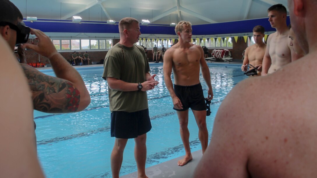 A Marine with 2nd Reconnaissance Battalion speaks with the students before beginning training aboard Camp Lejeune, N.C., Aug. 18, 2015. The pre-dive course is designed to strengthen the participants’ abilities before sending them to the Marine Combatant Diver Course at the Naval Diving and Salvage Training Center, Panama City, Fla. 