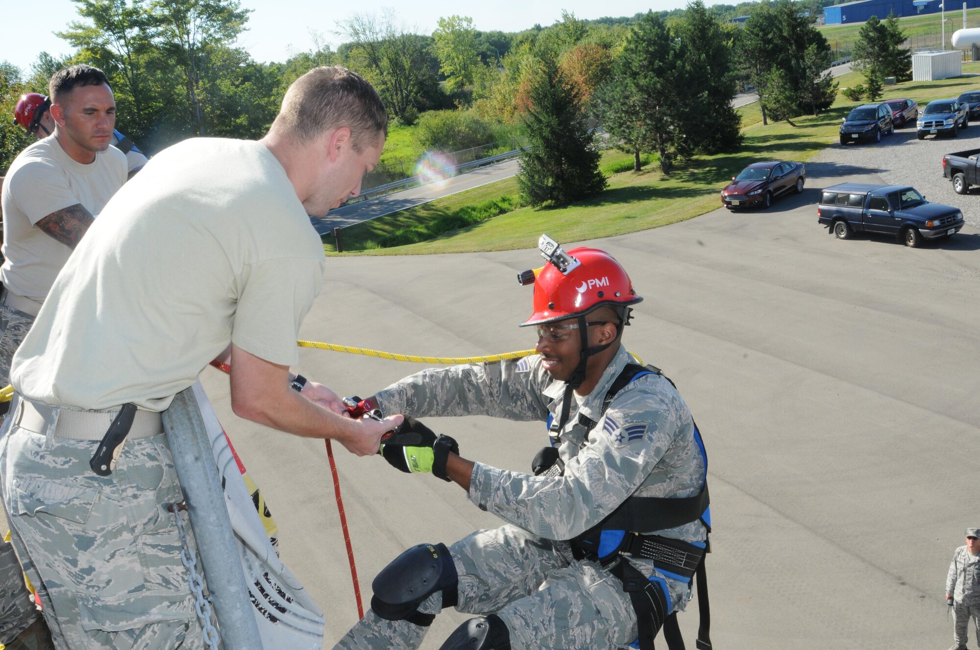 Senior Airman Jamal Hudson, a firefighter for the 910th Civil Engineer Squadron, takes a break during his first attempt at rappelling, here August 1, 2015. Rappelling is part of the required training for firefighters. (U.S. Air Force photo/ TSgt. Rick Lisum)