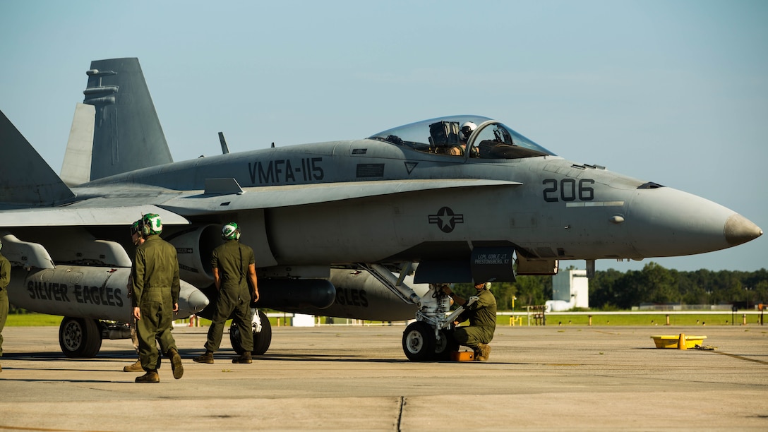 Marines prepare an F/A-18C Hornet to take off from Marine Corps Air Station Beaufort to participate in Sentry Savannah, Aug. 21. The hornet flew a joint mission with the Air Force simulating enemy aircraft in a large force exercise for the Marines are with Marine Fighter Attack Squadron 115, Marine Aircraft Group 31.